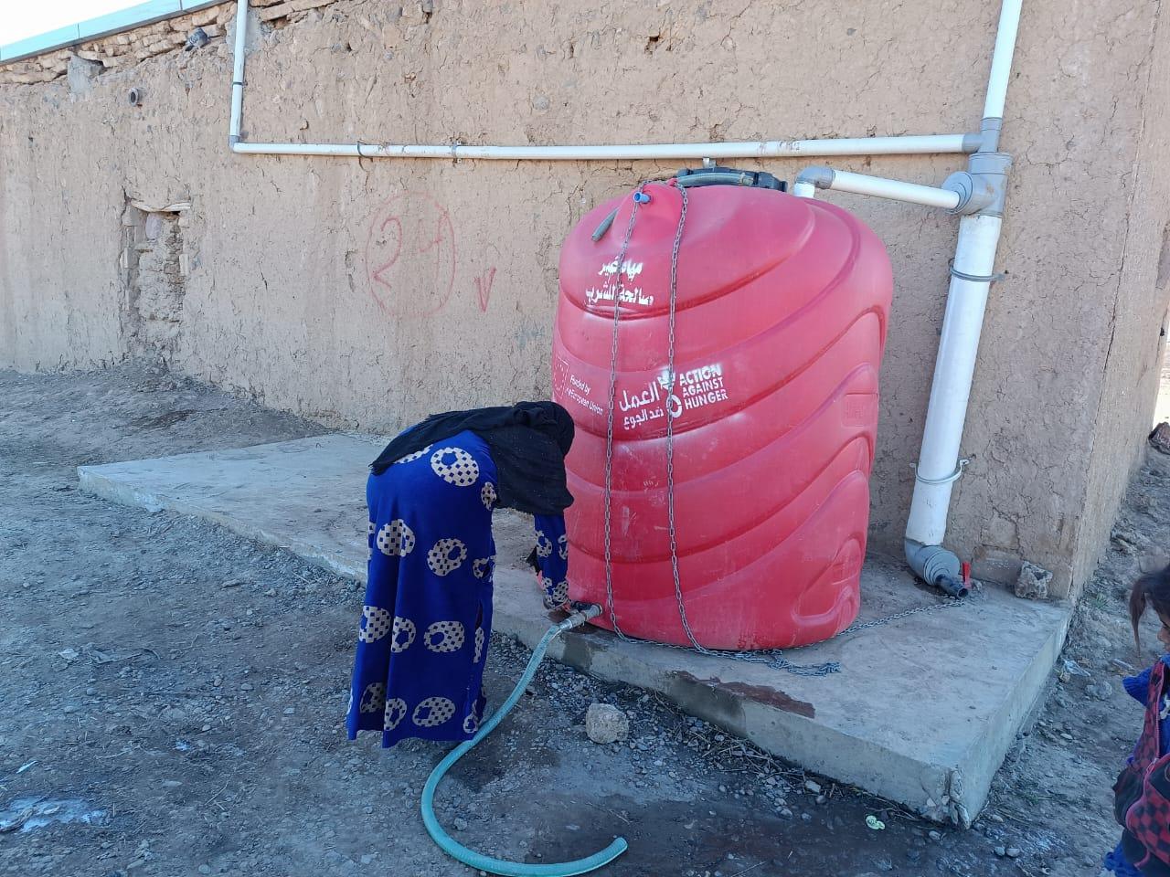 Jamila is using the provided water tank.